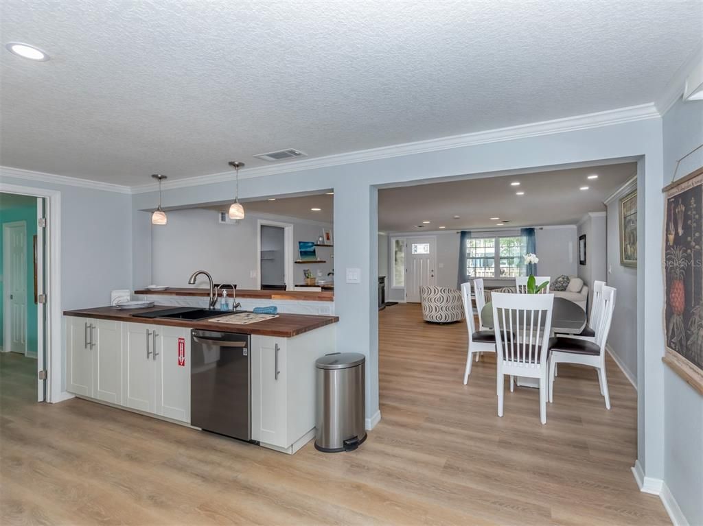 Dining room, Interior, Kitchen, Pendant Lights, Recessed Lighting, Stainless Steel Appliances, Wood Texture Flooring