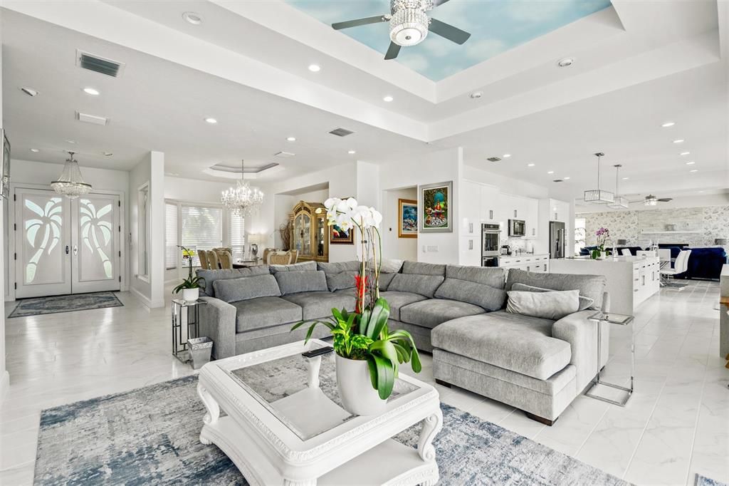Chandelier, Interior, Kitchen, Living room, Marble, Pendant Lights, Recessed Lighting, Stainless Steel Appliances, Stone Walls