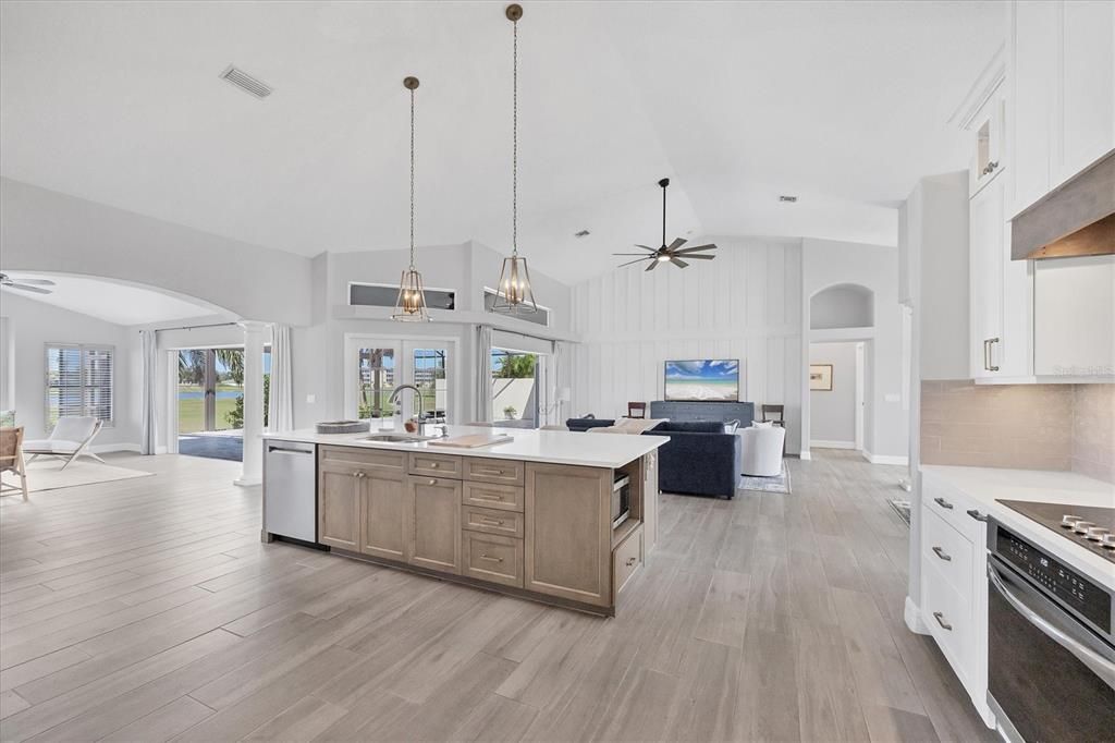 Dining room, Interior, Kitchen, Living room, Pendant Lights, Recessed Lighting, Stainless Steel Appliances, Wood Texture Flooring