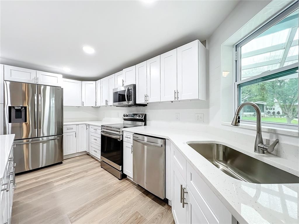 Interior, Kitchen, Recessed Lighting, Stainless Steel Appliances, Wood Texture Flooring