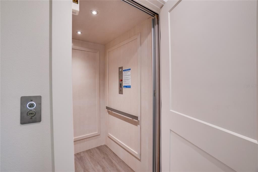 Elevator, Interior, Recessed Lighting, Wood Texture Flooring, Wooden Walls