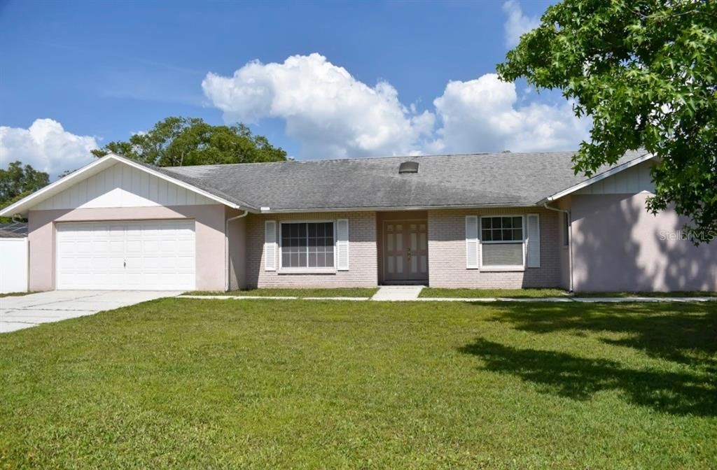 Attached, Backyard, Exterior, Facade, Brick Facade, Ranch