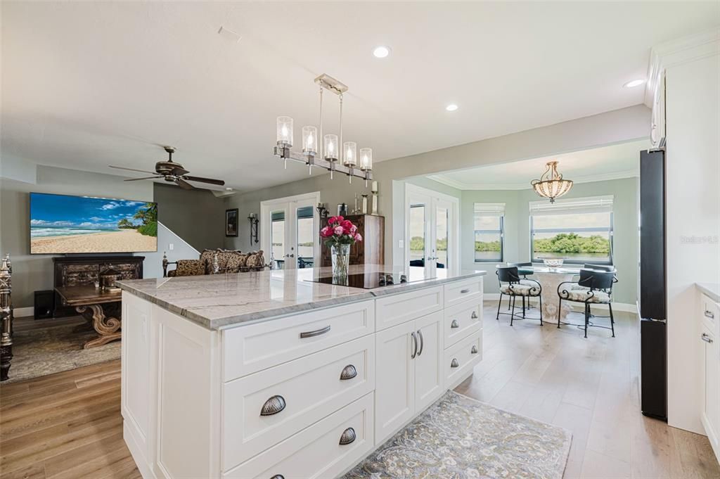 Dining room, Fireplace, Interior, Kitchen, Pendant Lights, Recessed Lighting, Wood Texture Flooring