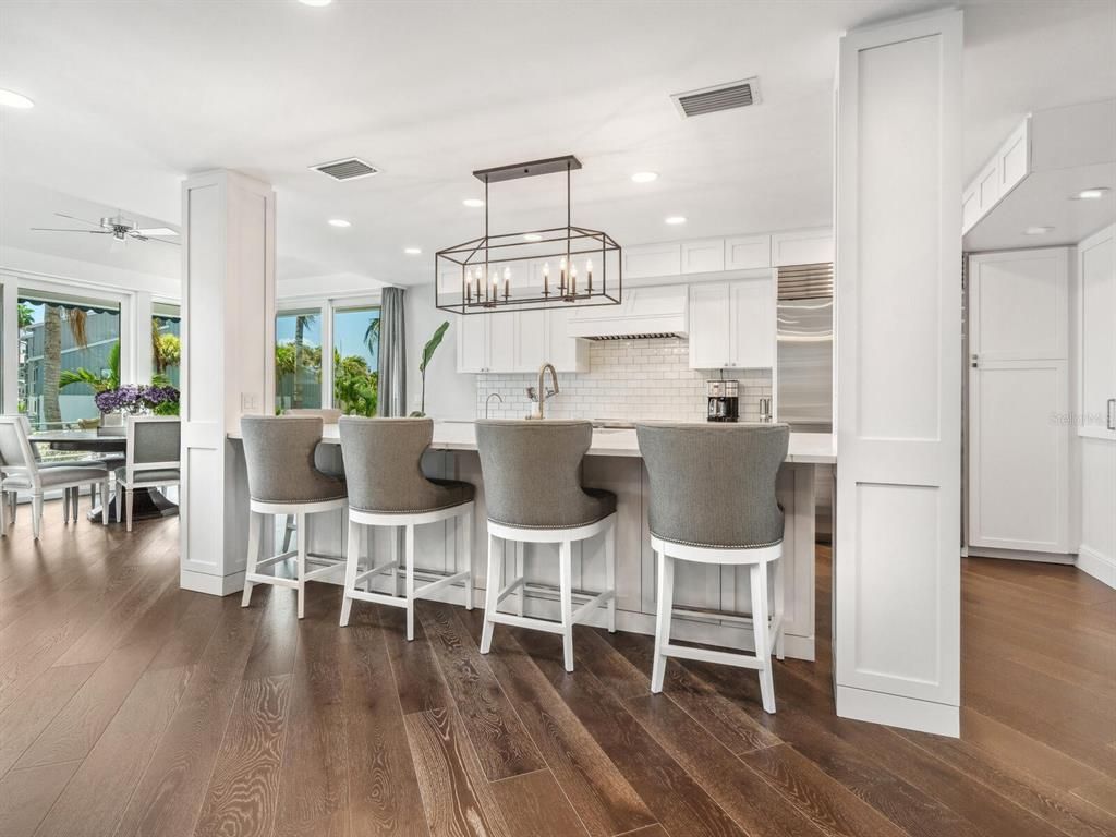 Chandelier, Dining room, Interior, Kitchen, Pendant Lights, Recessed Lighting, Stainless Steel Appliances, Wood Texture Flooring