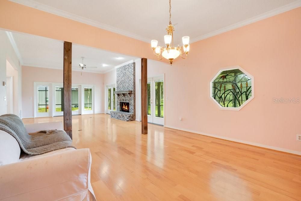 Chandelier, Empty room, Fireplace, Interior, Recessed Lighting, Wood Texture Flooring
