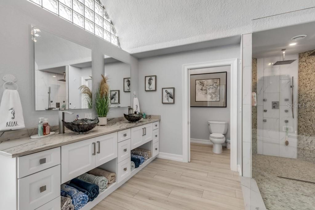 Bathroom, Dual Sink Vanities, Glass Shower, Interior, Recessed Lighting, Wood Texture Flooring