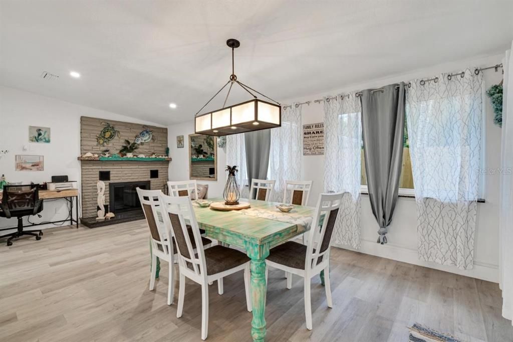 Dining room, Fireplace, Interior, Pendant Lights, Recessed Lighting, Stone Walls, Wood Texture Flooring