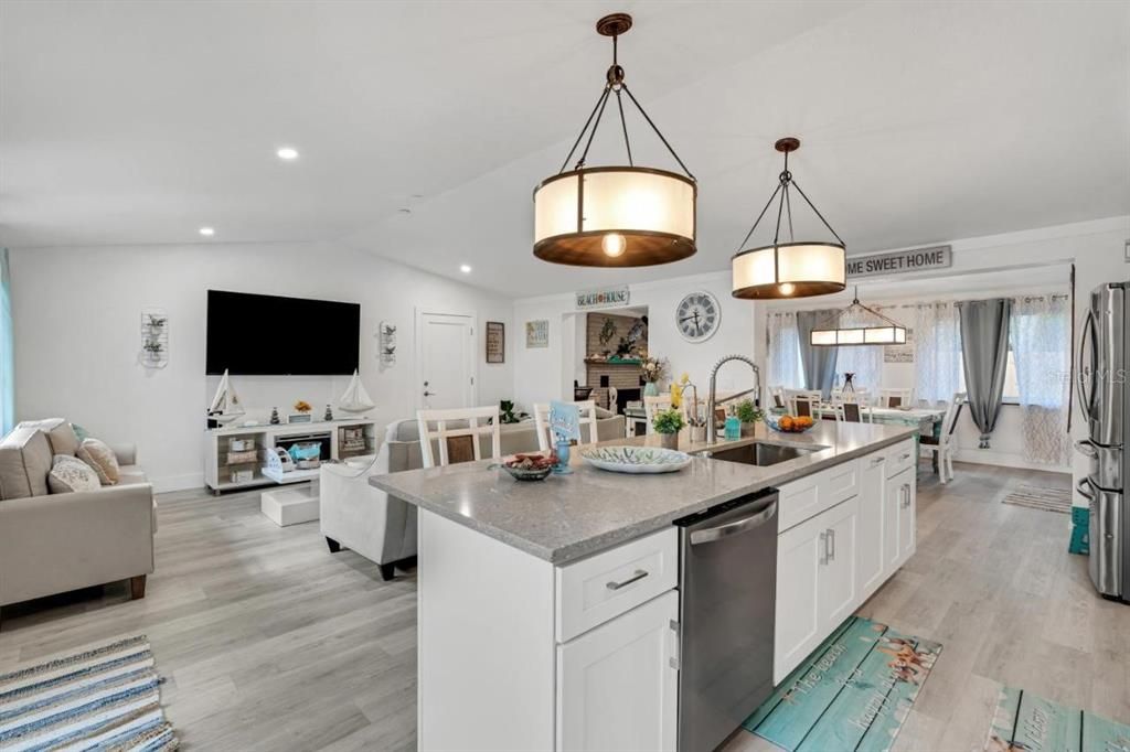 Dining room, Interior, Kitchen, Living room, Pendant Lights, Recessed Lighting, Stainless Steel Appliances, Wood Texture Flooring