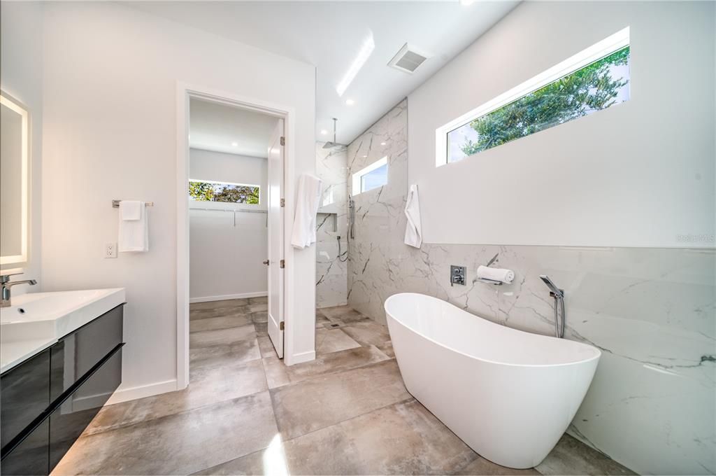 Bathroom, Free Standing Baths, Glass Shower, Interior, Marble Walls, Recessed Lighting
