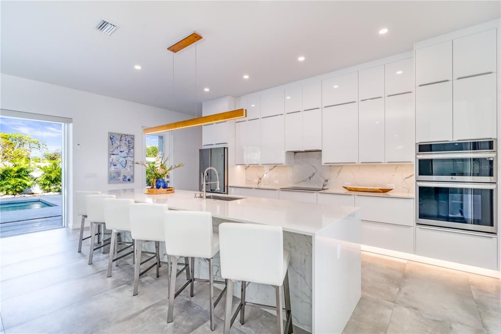 Interior, Kitchen, Marble Walls, Pendant Lights, Recessed Lighting, Stainless Steel Appliances