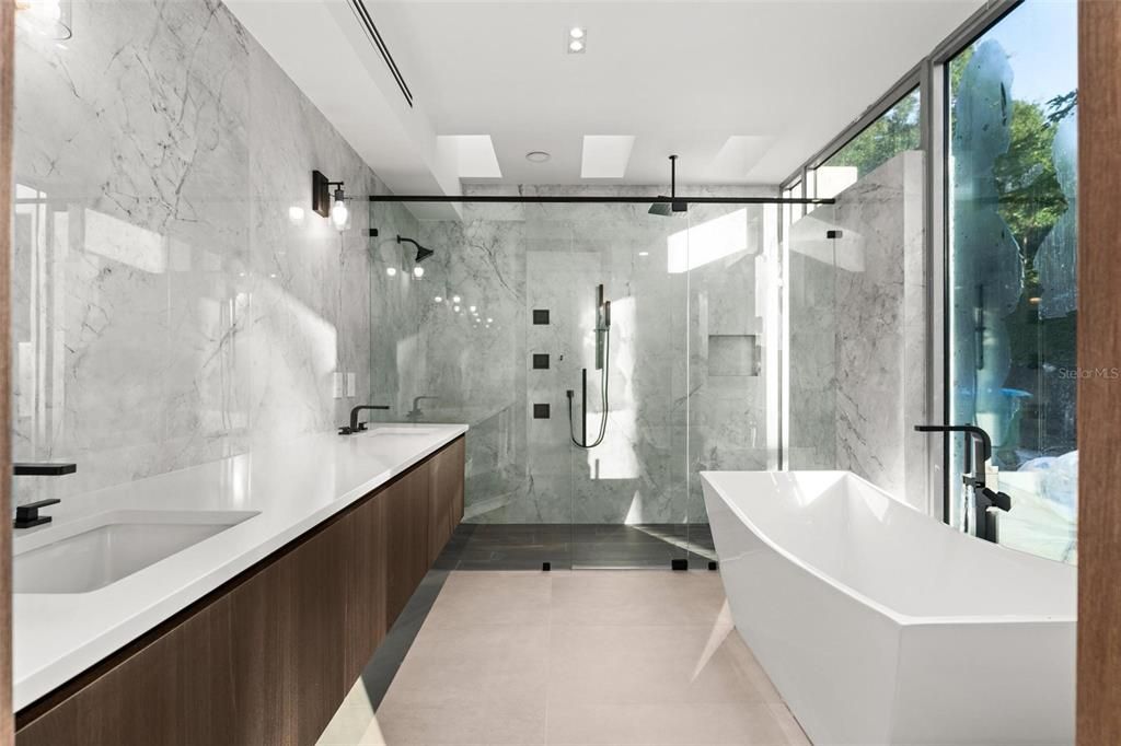 Bathroom, Dual Sink Vanities, Free Standing Baths, Glass Shower, Interior, Marble Walls, Recessed Lighting