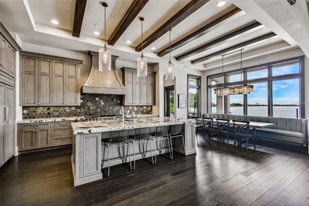 Chandelier, Dining room, Interior, Kitchen, Pendant Lights, Recessed Lighting, Stainless Steel Appliances, Water, Wooden Beams, Wood Texture Flooring
