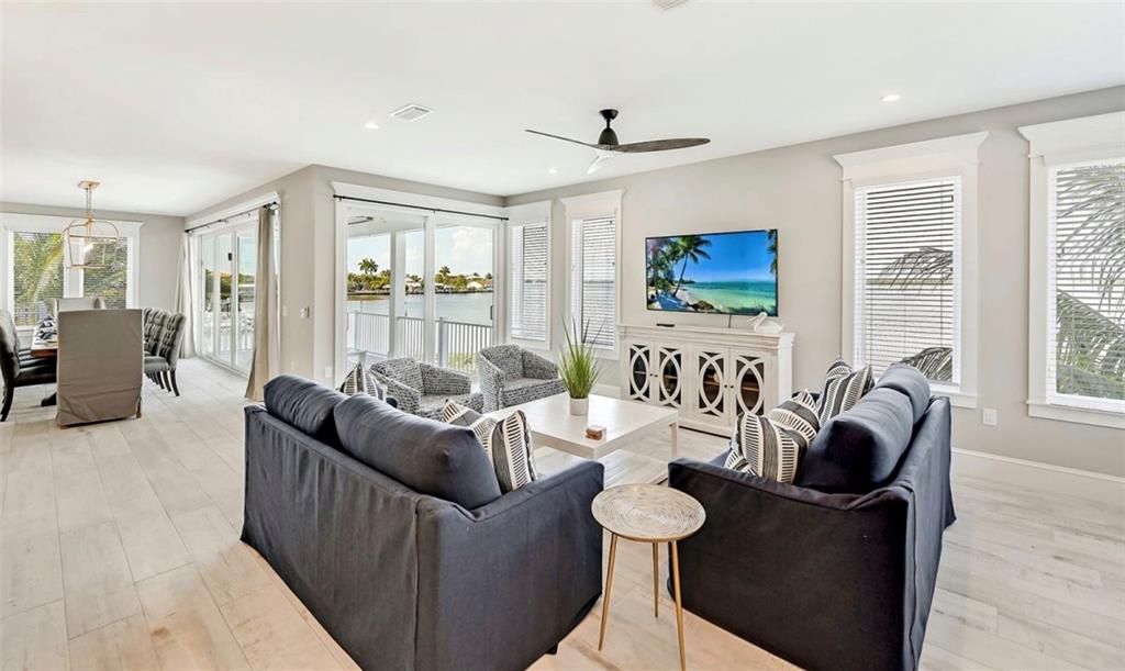 Dining room, Fireplace, Interior, Living room, Pendant Lights, Recessed Lighting, Wood Texture Flooring