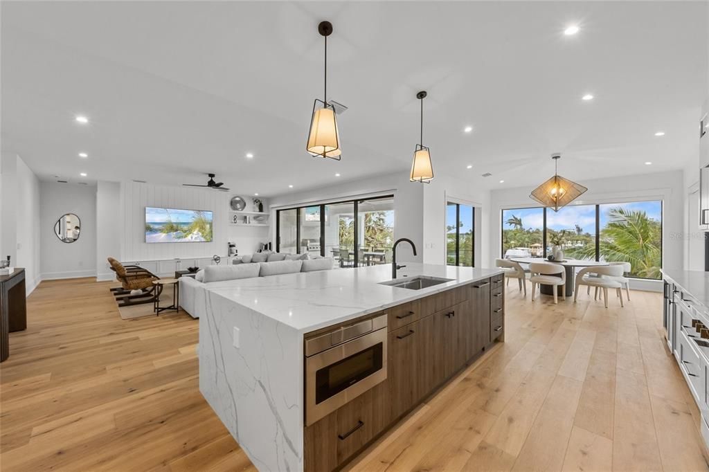 Dining room, Interior, Kitchen, Living room, Pendant Lights, Recessed Lighting, Stainless Steel Appliances, Wood Texture Flooring