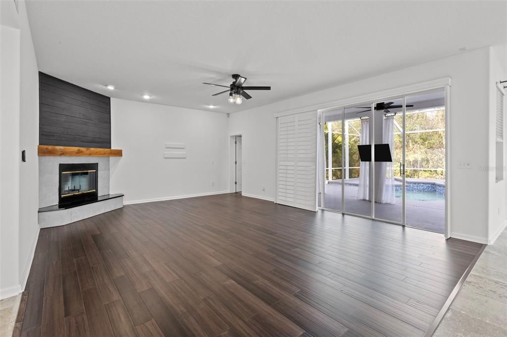 Empty room, Fireplace, Interior, Recessed Lighting, Wood Texture Flooring