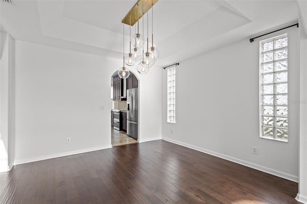 Chandelier, Empty room, Interior, Kitchen, Pendant Lights, Stainless Steel Appliances, Wood Texture Flooring