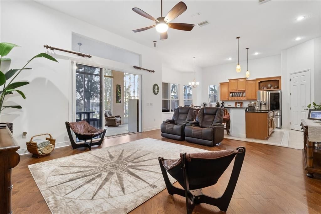 Chandelier, Interior, Kitchen, Living room, Pendant Lights, Recessed Lighting, Stainless Steel Appliances, Wood Texture Flooring