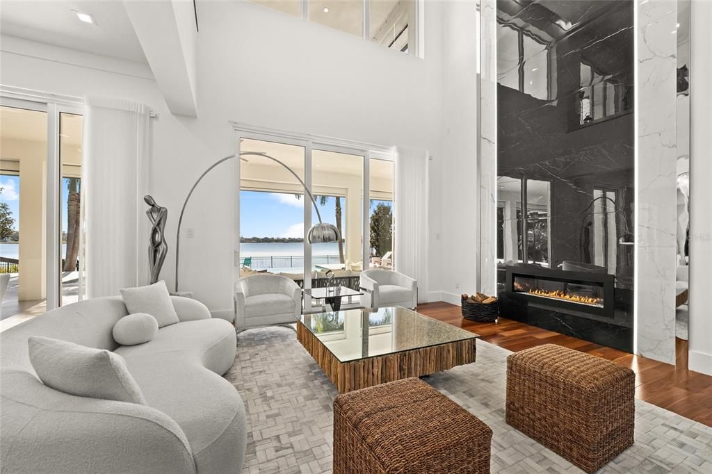 Fireplace, Interior, Living room, Recessed Lighting, Water, Wood Texture Flooring