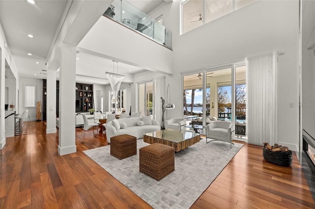 Dining room, Fireplace, Interior, Living room, Recessed Lighting, Wood Texture Flooring