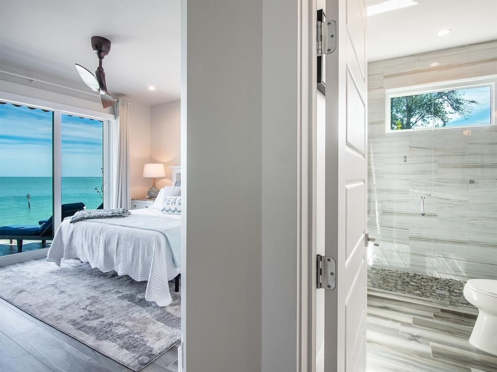 Bathroom, Bedroom, Glass Shower, Interior, Recessed Lighting, Water, Wood Texture Flooring
