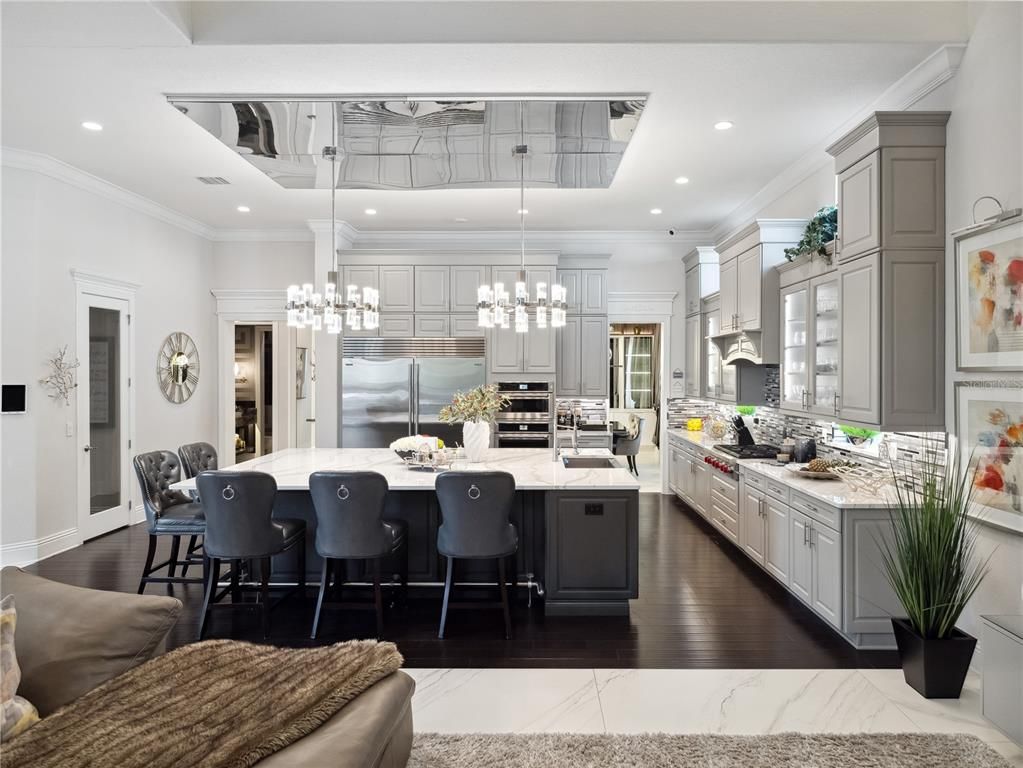 Chandelier, Interior, Kitchen, Marble, Pendant Lights, Recessed Lighting, Stainless Steel Appliances, Wood Texture Flooring