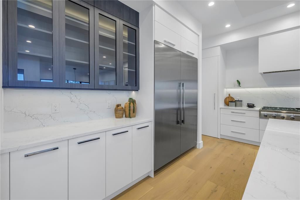 Interior, Kitchen, Marble Walls, Recessed Lighting, Stainless Steel Appliances, Wood Texture Flooring