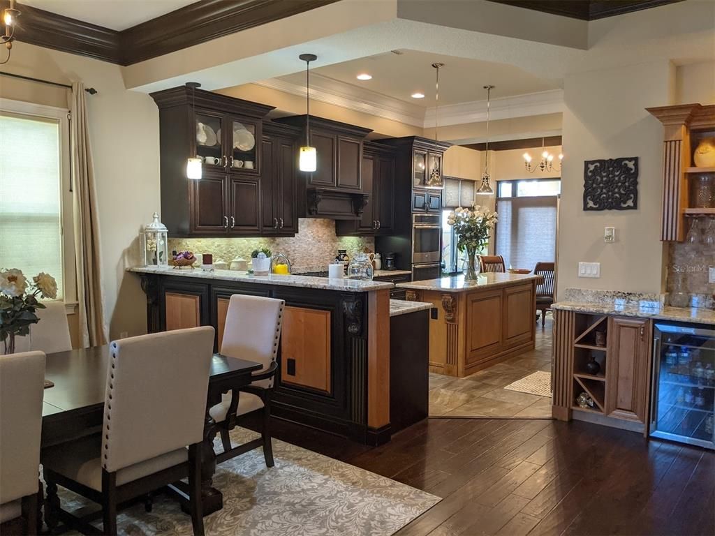 Dining room, Interior, Kitchen, Pendant Lights, Recessed Lighting, Stainless Steel Appliances, Wood Texture Flooring