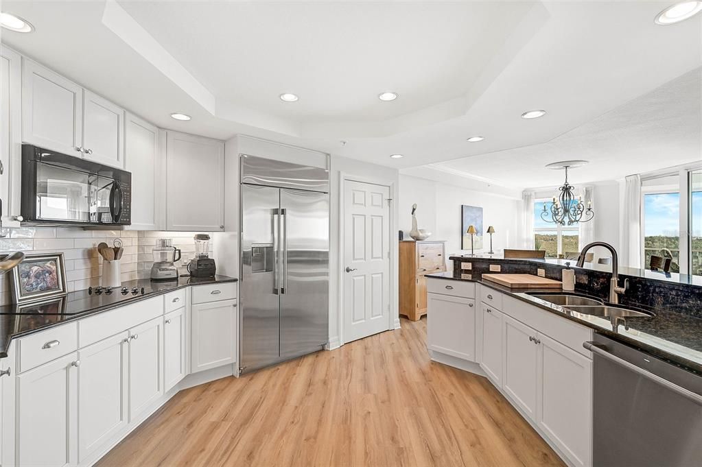 Chandelier, Interior, Kitchen, Recessed Lighting, Stainless Steel Appliances, Wood Texture Flooring