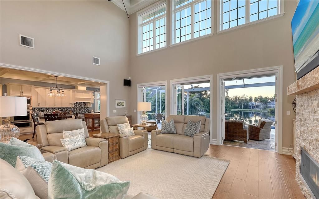 Dining room, Fireplace, Interior, Kitchen, Living room, Pendant Lights, Stainless Steel Appliances, Stone Walls, Wood Texture Flooring