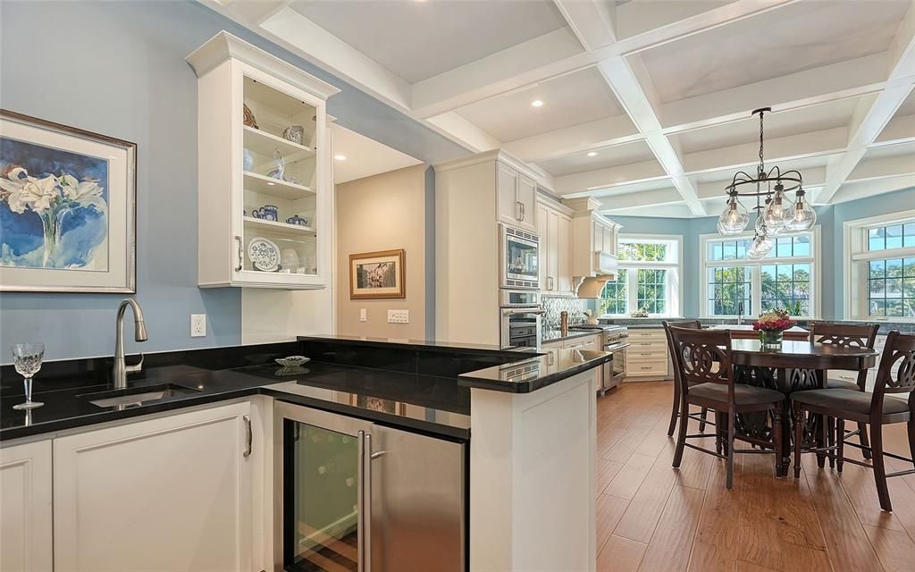 Chandelier, Dining room, Interior, Kitchen, Pendant Lights, Recessed Lighting, Stainless Steel Appliances, Wood Texture Flooring