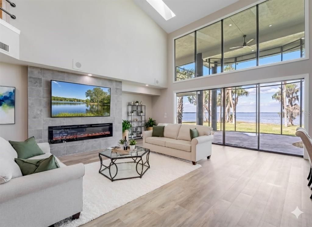 Fireplace, Interior, Living room, Recessed Lighting, Water, Wood Texture Flooring