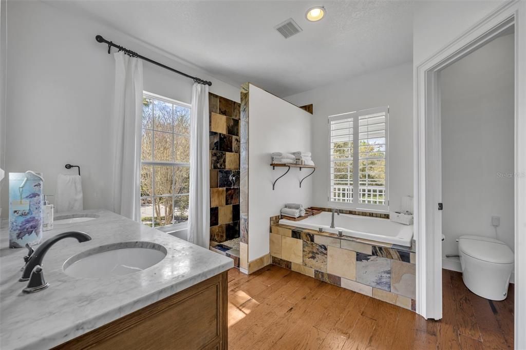 Bathroom, Dual Sink Vanities, Interior, Recessed Lighting, Wood Texture Flooring