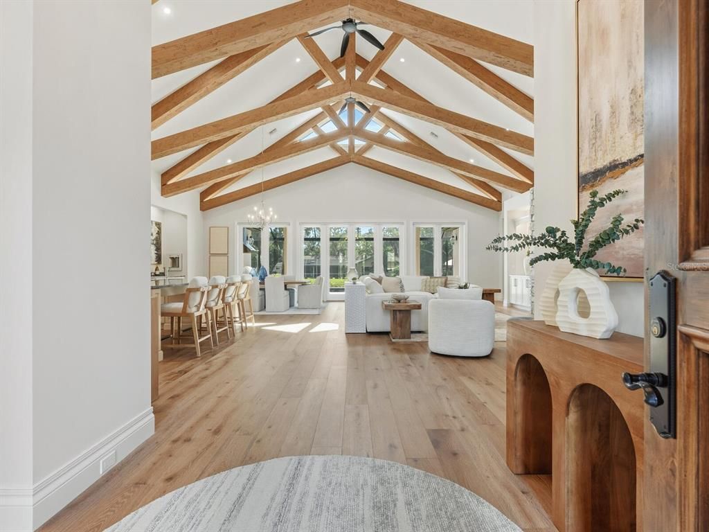 Chandelier, Dining room, Interior, Living room, Pendant Lights, Recessed Lighting, Wooden Beams, Wood Texture Flooring