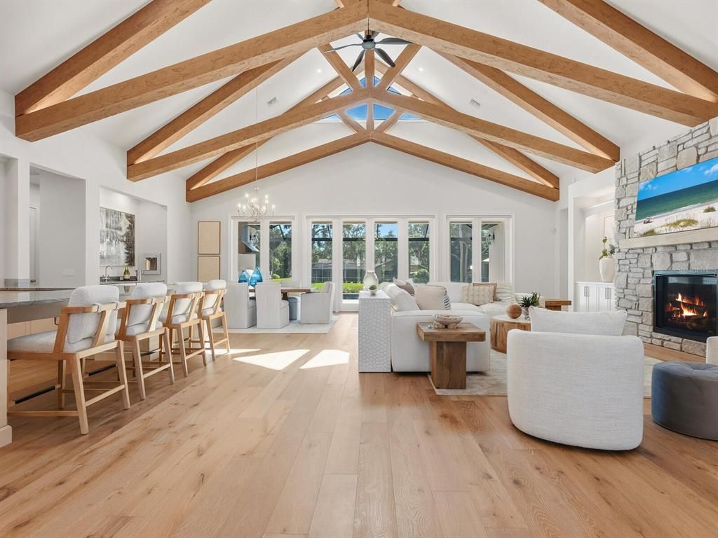 Dining room, Fireplace, Interior, Living room, Pendant Lights, Recessed Lighting, Wooden Beams, Wood Texture Flooring