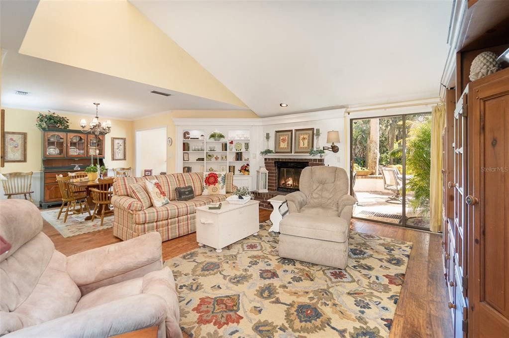 Chandelier, Dining room, Fireplace, Interior, Living room, Recessed Lighting, Wood Texture Flooring