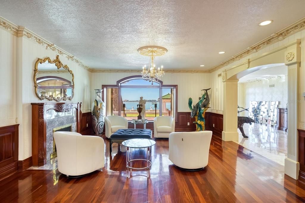 Chandelier, Fireplace, Interior, Living room, Recessed Lighting, Water, Wood Texture Flooring