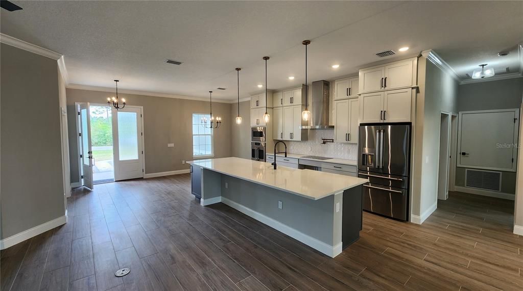 Chandelier, Interior, Kitchen, Pendant Lights, Recessed Lighting, Stainless Steel Appliances, Wood Texture Flooring