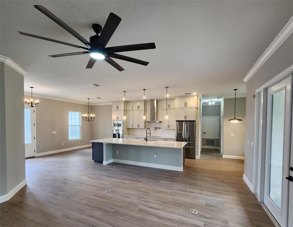 Chandelier, Interior, Kitchen, Pendant Lights, Stainless Steel Appliances, Wood Texture Flooring