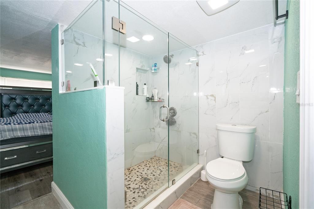 Bathroom, Glass Shower, Interior, Marble Walls, Recessed Lighting, Wood Texture Flooring