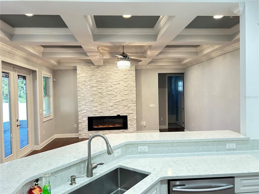 Fireplace, Interior, Kitchen, Recessed Lighting, Stone Walls, Water
