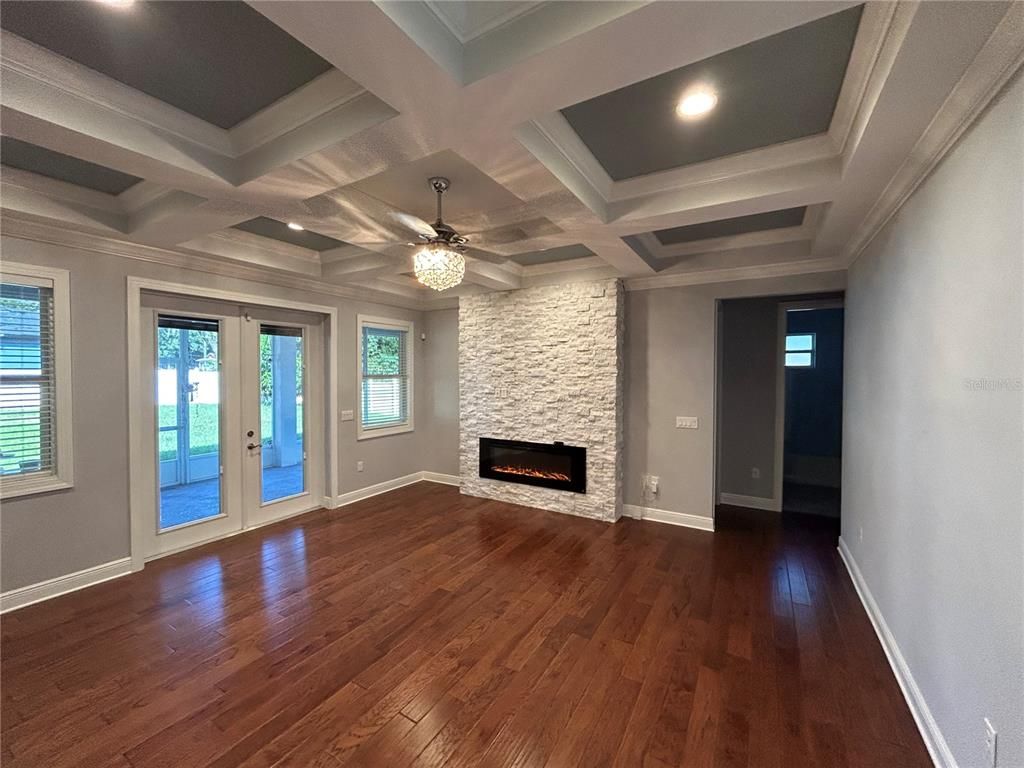 Empty room, Fireplace, Interior, Recessed Lighting, Wood Texture Flooring