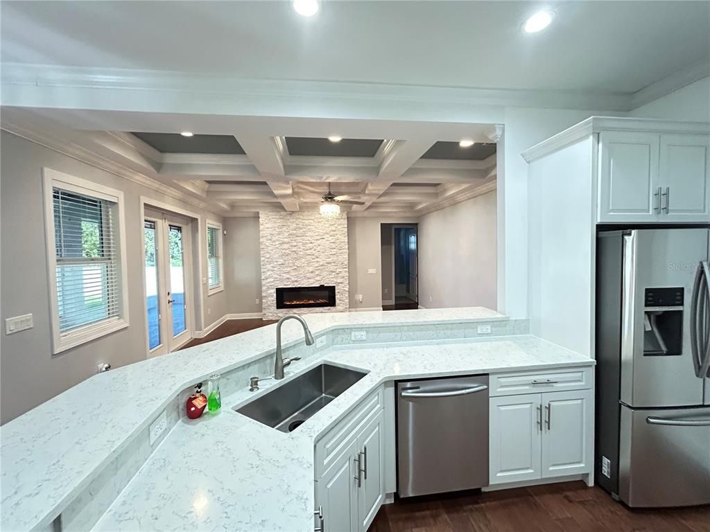 Fireplace, Interior, Kitchen, Recessed Lighting, Stone Walls, Wood Texture Flooring