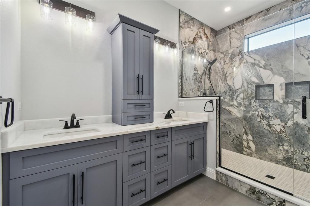 Bathroom, Dual Sink Vanities, Glass Shower, Interior, Marble Walls, Recessed Lighting