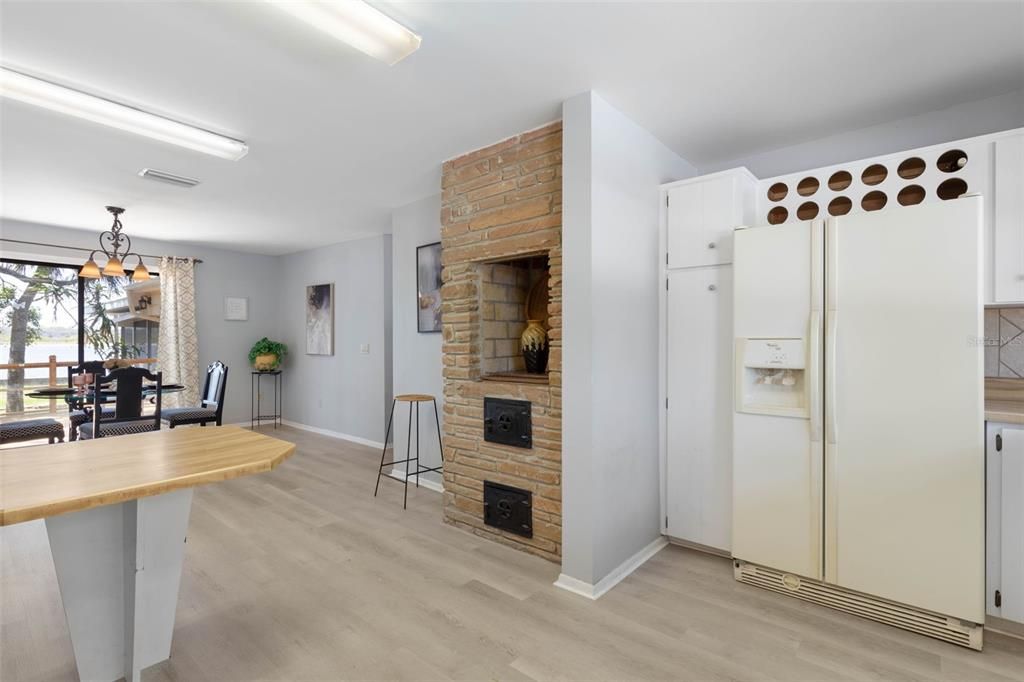Dining room, Fireplace, Interior, Kitchen, Pendant Lights, Stone Walls, Wood Texture Flooring