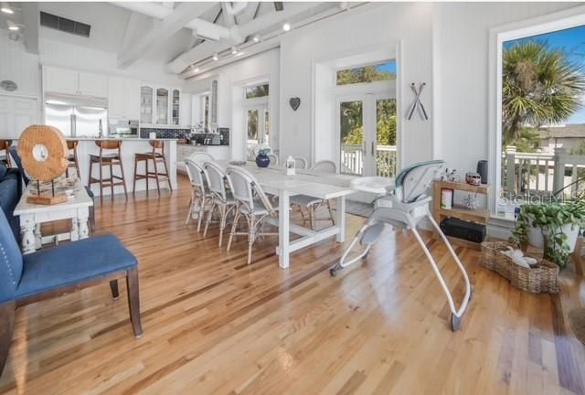 Dining room, Fireplace, Interior, Kitchen, Recessed Lighting, Wood Texture Flooring
