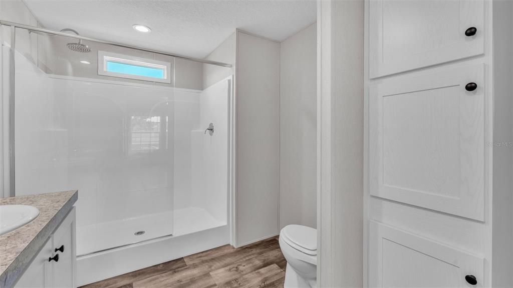 Bathroom, Glass Shower, Interior, Recessed Lighting, Wood Texture Flooring