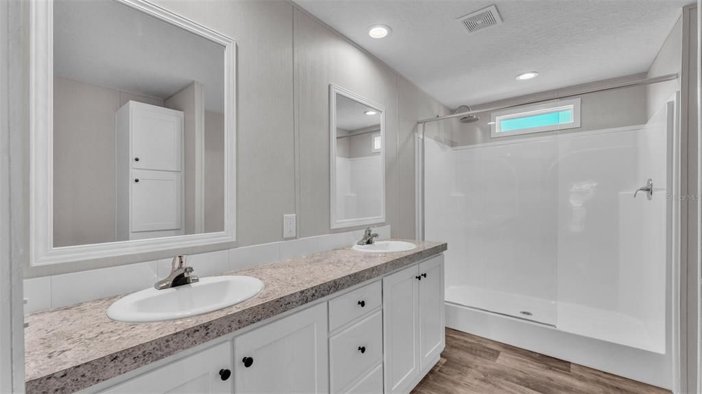 Bathroom, Dual Sink Vanities, Interior, Recessed Lighting, Wood Texture Flooring