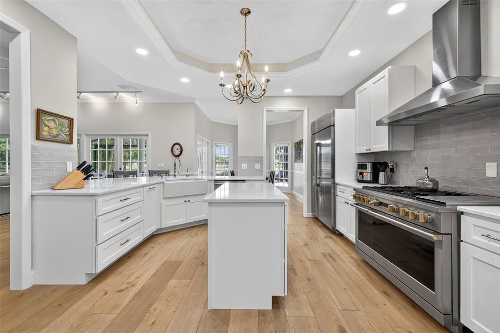 Chandelier, Interior, Kitchen, Pendant Lights, Recessed Lighting, Stainless Steel Appliances, Wood Texture Flooring
