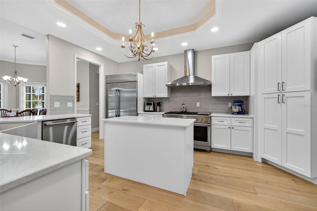 Chandelier, Interior, Kitchen, Pendant Lights, Recessed Lighting, Stainless Steel Appliances, Wood Texture Flooring
