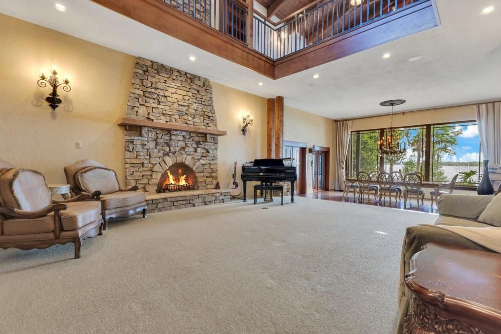 Chandelier, Dining room, Fireplace, Interior, Piano, Recessed Lighting, Stone Walls
